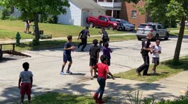 US police officers join kids' football game after someone reported them for 'playing outside'