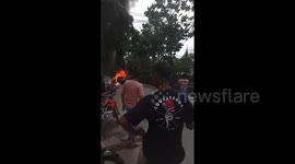 A Car Burned Out in the Middle of the City