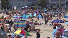 Britons head to the beach on the hottest day of the year so far