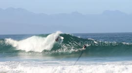 Surfer Bailing in Plettenberg Bay, South Africa