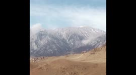 Dust clouds form from rockfall in the eastern Sierra after 5.8 earthquake hits Central California