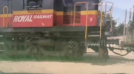 Pickup truck hit by oncoming train after driving over level crossing