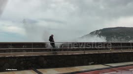 Waves knock down bystanders in Spain