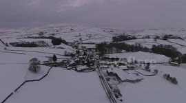 Snowy Cumbria landscape from drone