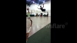 Celebratory backflip near-miss on basketball court