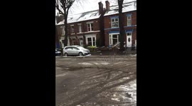 Car crashed into house in sheffield in snow