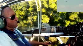 Stunt plane pilot dodges trees in aerobatic landing