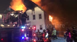 Fire crews tackle house fire in Chelsea, MA, US