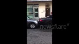 Jaguar crammed into impossibly tight parking space in London