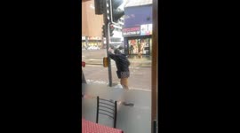 Street light fighting man: Worse-for-wear Belfast gent has scrap with lamp post