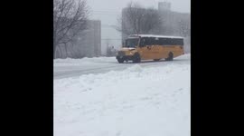 School bus driven through heavy snow in Atlanta, Georgia