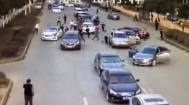 Rival armed gangs fight on a busy road in China