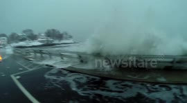 Waves batter Massachusetts fishing town during US blizzard
