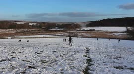 1000s of people headed for the hills of dartmoor for the snow, sunny sunday flocks of people headed for dartmoor