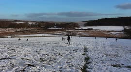 1000s of people headed for the hills of dartmoor for the snow, sunny sunday flocks of people headed for dartmoor