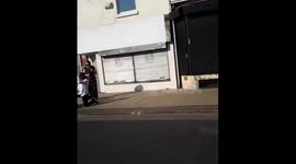 Protesters Holding Signs Take a Knee in Manchester