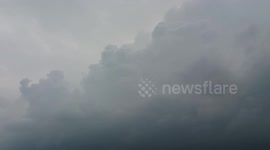 Big Thunderstorm Clouds Growing Over Busy Route