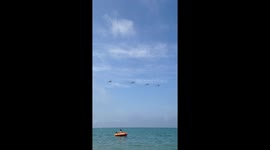 Helicopter flyes above the sea