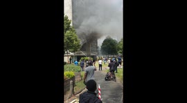 London tower block billows smoke as fire engulfs flat