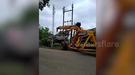 Three people cheat death after crashing car onto electrical wires in India
