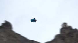 Three daredevils base jump from Swiss mountain in their wingsuits