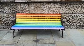 Rainbow painted bench seen in Trafalgar Square for Pride Month