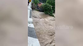 Flash floods swamp roads after heavy rain in night in the Philippines