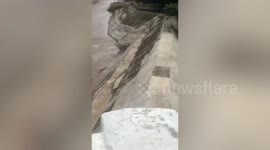 Heavy rain causes swollen river and flash floods in the Philippines