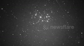 Geminids meteor with smoke trail visible for over 10 minutes passing close to the Pleiades