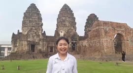 Monkeys steal schoolgirl's headband while she does presentation in Thailand