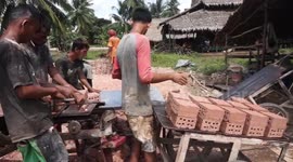 Brickworkers cutting up blocks for baking is so strangely satisfying