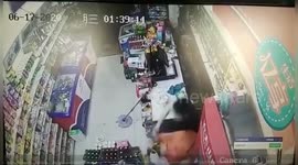 Shop assistant in China smashes six beer bottles on knife-wielding robber's head to subdue him