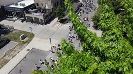 Aerial drone crashes into tree while capturing video of protest