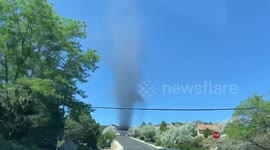 Dust devil swirls after picking up ashes from 'Poeville fire' in Reno