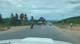 Newsflare Edit - Locals move house by driving it along road in Cambodia
