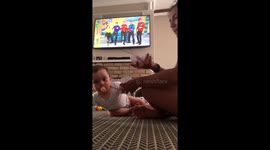 Adorable baby Percy laughs at mummy juggling toys.