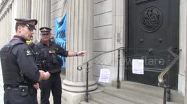 Extinction Rebellion block Bank of England entrance with string causing a