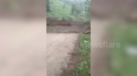 Landslide sweeps through village in the Philippines after heavy rain