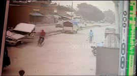SUV bounces off road narrowly missing cyclist after getting hit by truck