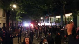 Protesters seen running as police threaten to fire tear gas in Portland