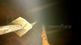 Descend down some steps into a submerged well room and  15 mt deep water well