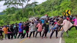 Moment villagers come together to pull pickup truck to safety after vehicle tumbled 80 metres down mountain