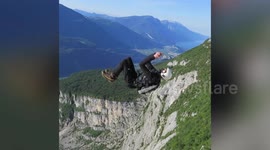 Daredevil solves cube puzzle while doing front flip in freefall
