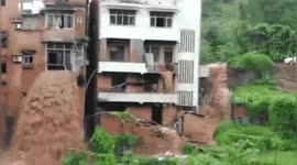 Floodwater pours from second-floor flat like a waterfall after rainstorm in southern China