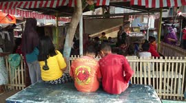 Students in Indonesia study in cemetery as classrooms are closed