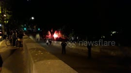 Illegal ProjectX party: the partygoers play to cat and mouse with the police. Flares and firecrackers are launched. Paris, Pont de Sully (bridge).3july2020