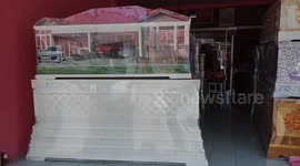 Thai coffin shop decorates caskets as pink home