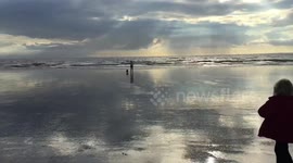Family enjoy silver beach