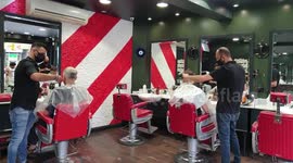 Hairdressers reopen in England for the first time in three months