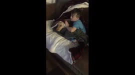 Heartwarming moment young boy comforts his scared dog during fireworks